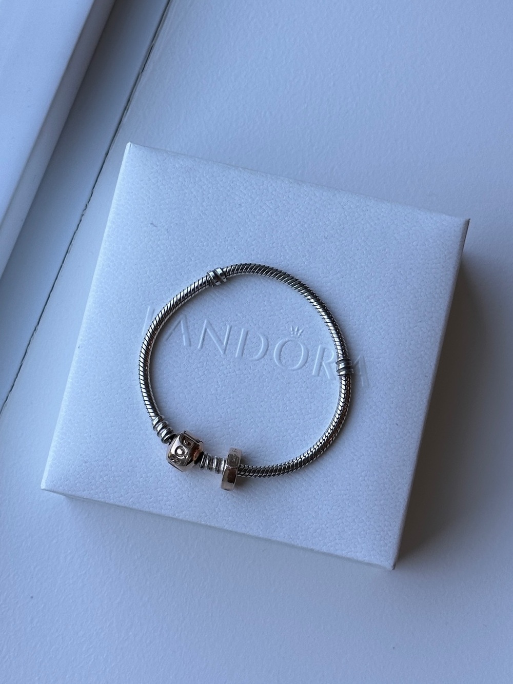 Pandora bracelet with rose gold clasp and one rose gold charm